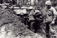 Soldiers took cover in dugouts near Bruyeres [U.S. Army Signal Corps]