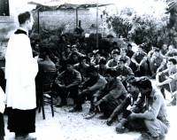 Chaplain Yost conducts church services in Orciano, Italy, July 1944 [U.S. Army Signal Corps]