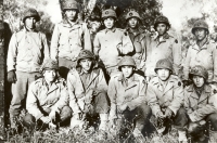 Men of Co. E, 100th Inf. Bn., Nov. 1943, shortly after first crossing of the Volturno River, Italy Back row, left to right: Yozo Yamamoto, Henry Shiyama, Yoshikatsu Matsumoto, Kaoru Yamamoto, Charles J. Okimoto, Takeshi Lefty Kimura. Front row, left to right: Kunio Fujimoto, Susumu Kunishige, Raymond Yokoyama, Katsumi Jinnohara, Kaoru Yonezawa. [U.S. Army Signal Corps]