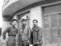 Tom shibao, George Mizuno, and Kow Ito stand in front of an Italian store. [Courtesy of Bernard Akamine]