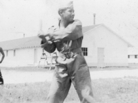 Lt. Tanaka at bat. Old camp. [Courtesy of Bert Hamakado]