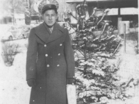 Tadayoshi Hamasaki poses in front of a Christmas tree in La Crosse, Wisconsin, November 28, 1942. [Courtesy of Mary Hamasaki]