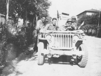 Tadayoshi Hamasaki and friends drive a jeep through an Italian town. [Courtesy of Mary Hamasaki]