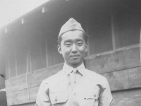 Kwon and Kuhaki (in background on steps) Sargeant Harada (posing in uniform) Jan. 1941.   [Courtesy of Mike Harada]