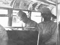 I'm busy reading news.Stanley eyeing beautiful miss. On top deck of Chicago's double deck bus. (L) Tom Ibaraki, ( R) Stanley ___. [Courtesy of Dorothy Ibaraki]