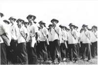 VVV assembled in formal dress with gas masks. Identifiable men are Harry Sato, Yoshiyuki Hirano, Yasuhiro Fujita, James Okuda, David Fujita, Thomas Shintani, Masato Yoshimasu, Minoru Ikehara, and James Oka [Courtesy of VVV #10. Ted Tsukiyama Papers, University of Hawaii at Manoa Library]