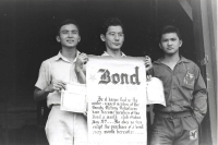 Members of the VVV with their pledge to buy war bonds monthly from left: George Tokuyama, Henry Oyasato, and Yoshihara Mikami [Courtesy of Ted Tsukiyama Papers, University of Hawaii at Manoa Library]