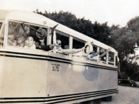 (March 24, 1941) 2nd Draft Inductees. Eugene Kawakami  is seen wearing sunglasses, waving with his hat in hand.     [Courtesy of Joanne Kai]