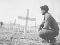 Conrad Kurahara pays his respects at a graveyard in Italy. [Courtesy of Jane Kurahara]