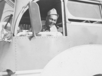 Joe Takata at the Drivers Seat of the famous Greyhound bus. [Courtesy of Leslie Taniyama]