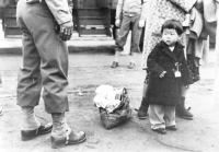 An American child of Japanese descent is tagged for incarcration in Los Angeles, California [Visual Communications Archives, Los Angeles]