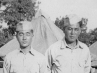 1942 Camp Shots - McCoy.  Taken July 20, 1942 on company street just beore our tents.  Myself and Masao Hatanaka (from Moilili).  [Courtesy of Jan Nadamoto]