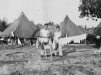 Kawasaki & Nadamoto.  Haircut - GI Life for You!  Taken just back of Co. G  row of tents.  [Courtesy of Jan Nadamoto]