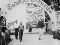 Taken August 9, 1942 at Wisconsin Dells, Wisc. In background is the Wisconsin River.  At the right entrance is the Indian girl that rents the war bonnets.  Just below of the back fence (metal) in background is the docking place of the tour  boats.  Lots of visitors that day (civilian) that day.  [Courtesy of Jan Nadamoto]