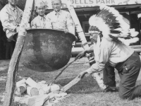 Hey!! What's this!  Taken August 9, 1942 at Wisconsin Dell Park as you can very well see by ths sign in background. About to be cooked by Indian Chief Blow Snake.  [Courtesy of Jan Nadamoto]