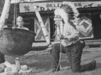 Taken August 9, 1942 at Wisconsin Dells Park, Wis. Chief Blow Snake obligingly offered to "cook" Fred Kanemaru for supper.   (This goes to my photograph album too). All the others of sceneries & myself you folks may keep.)  But where I'm not int trhe picture and those of my friends only put in my album.  [Courtesy of Jan Nadamoto]