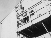 Taken Oct. 8, 1942 on the rear end of our barracks-second floor whre our platoon sleeps.  Steps-ladder & on left is the fire escape.  [Courtesy of Jan Nadamoto]