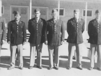 Our Officers.  Extreme left is our first Sgt.  Picture of our officers taken Oct. 10, 1942 at New Camp McCoy.  From Left to Right. 1st Lt. Ernest Tanaka, 2nd Lt. McKelvey, Capt. Clarence R. Johnson, 2nd Lt. Lee Blood and 2nd Lt. Kenneth Eaton.  The are all 1st Lts. now). Missing from pictue is 1st. Lt. Richard Mizuta.  [Courtesy of Jan Nadamoto]