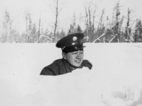 Snow Pics all taken at New Camp McCoy, Wisconsin.  Nov. 29, 1942 Isn't the snow dep though.  The snow on the foreground shows it, doesn't it.  The reason I'm most way down is because I'm lying down in a small gulch right along the roadside.  [Courtesy of Jan Nadamoto]