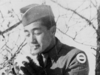 Taken Nov. 29, 1942.  Taking a piece of snow to see how it tastes.  [Courtesy of Jan Nadamoto]