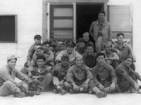 Cat Island and Ship Island Gang, Mississippi, 1942, Bottom row, L to R: William Takaezu, Tokuji Ono, James Komatsu, Fred Kanemura, Koyei Matsumoto, Yasuo Takata. Middle row,  L to R: Unknown, Robert Takashige (with hat), Seiji Tanigawa, John Kihara, Yukio Yokota (with arm on Kihara's shoulder). Top row, L to R:  Seiei Okuma, Takeshi Tanaka (arms around man in front of him), unknown, Masao Hatanaka, Katsumi Maeda, Ray Nosaka, Robert Goshima (standing). [Courtesy of Raymond Nosaka]