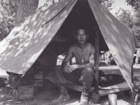 Stanley Hamamura in Pup Tent, 1944 [Courtesy of Fumie Hamamura]