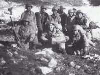 Forward Command Group, Radio & Message Center Unit, Headquarters Co, Near Cassino, winter 1943. 1st Row, l-r: Tamotsu Shimizu, Stanley Ushijima, Roy Nakamura. 2nd Row, l-r: Edward Ikuma, Maj. Oscar King, Hidenobu Hiyane, Seiji Kimura, Katsuto Komatsu, Howard Yamamoto. [Courtesy of Fumie Hamamura]