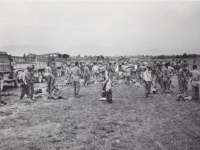 Nisei soldiers strip  search German P.O.W.’s at the Ghedi Airstrip, Italy, June 1945. [Courtesy of Fumie Hamamura]