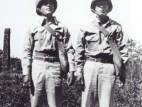 Stanley Hamamura and Sueo Noda with gas masks, in Hawaii, winter 1942. [Courtesy of Fumie Hamamura]