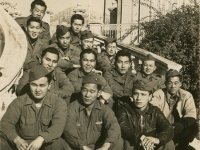 Message Center, Communications Section, Headquarters Co. Menton, France, December 1944. Front row: Raymond Sato, Kungo Iwai, Harold Tamashiro, Yoshio Ogomori. 2nd row: unknown, Fred Kurisu, Irish Ohara, Tom Fujise. 3rd row: Hiromu Heyamoto, Sam Hanashiro, G.I. Tanaka, Jockey Ishikawa. 4th row: Ed Ikuma, Keichi Kimura. (Courtesy of Joyce Walters)