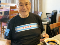Ikuro “Mano” Kawahara enjoys his Hawaiian coffee in his “Go For Broke” mug. [Courtesy of Gigi McPhee]