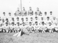 The 100th Battalion had a baseball team which competed against top teams in the state while stationed at Camp McCoy, Wisconsin. Team members and officers in this September 1942 photo are: front row L-R, Haruo Hayakawa, Yozo Yamamoto, Masaharu Takeba, Fred Wada, Wataru Kaneshina, Masahiko Miyagi, Yoshinao Omiya, Shunji Suzuki, Tadashi Ohta, Shigeo Igarashi. Second row L-R, Edward Mitsukado, Seiji Tanigawa, Shigeo Takata, Moichi Okazaki, Kenneth Kaneko, Toshio Mizusawa, Goro Moriguchi, Masaru Yamamoto, Hide Yamashita, Tadashi Matsunami, Ted Hirayama. Third row L-R, John Y.Yamada, Koichi Fukuda, Sam Tomai, Ronald Hamamura, Akira Akimoto, Al Nozaki, Henry Shiyama, Fumi Taniyama, Tadao Honbo, Mits Omori. Back row L-R, Capt. Katsumi Kometani, Col. Farrant Turner, Maj. James Lovell, Capt. Kiyoshi Kuramoto. [Courtesy of Sandy Tomai Erlandson]