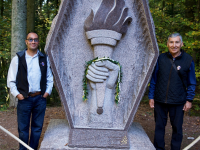 Kaoru Miyamoto’s grandson Todd (left) and son Stanford (right), at the new 442nd RCT memorial dedication in Bruyères (2017). [Photo courtesy of Stanford Miyamoto]