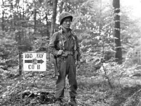S/Sgt. James Kawashima standing guard near Co. B command post at Bruyères, France. [U.S. Army Signal Corps photo]