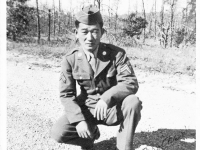 James Kawashima in dress uniform kneeling in a field [Courtesy of Alexandra Nakamura] Inscription: your brother, James