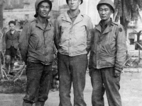James Kawashima (far right) with friends standing in front of a monument in Italy, December 1943 [Courtesy of Alexandra Nakamura]
