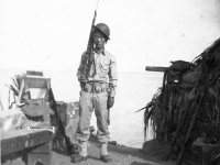 James Kawashima standing with rifle on his shoulder in at Wailea Point, Hawaii [Courtesy of Alexandra Nakamura]