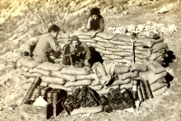 100th Infantry Battalion mortar crew, possibly in Italy, with Kiyoshi Furumoto on the phone. [Photo courtesy of Emily Furumoto]