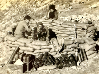 100th Infantry Battalion mortar crew, possibly in Italy, with Kiyoshi Furumoto on the phone. [Photo courtesy of Emily Furumoto]