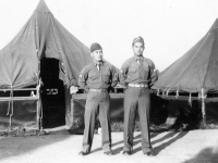 Sonsei Nakamura, and Daniel Wada standing in front of their tents at Camp McCoy, Wisconsin [Courtesy of Sonsei Nakamura]