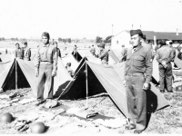 Yeiki Kobashigawa & Sonsei Nakamura on the side of a tent at Camp McCoy, Wisconsin [Courtesy of Sonsei Nakamura]