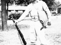 Sonsei Nakamura standing with rifle in hand, Camp McCoy, Wisconsin [Courtesy of Sonsei Nakamura]