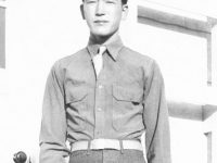 Saburo Hasegawa in front of barracks at Camp McCoy, Wisconsin [Courtesy of Goro Sumida] Inscription: To Goro, Saburo Hasegawa. Saburo Hasegawa