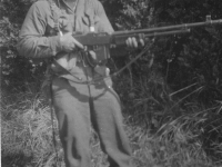 Nakama posing with gun. [Courtesy of Mrs. William Takaezu]