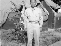 Sajiro Higa in front of tent at Camp Shelby. [Courtesy of Mrs. William Takaezu]