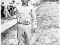 Tadao Hodai poses with snake at Camp Shelby, Mississippi. [Courtesy of Mrs. William Takaezu]