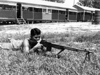 William Takaezu practicing with a rifle on Ship Island, Mississippi. [Courtesy of Mrs. William Takaezu]