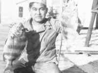 Herbert Ishii with sheepshead fish on Cat Island, Mississippi. [Courtesy of Mrs. William Takaezu]