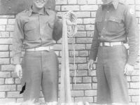 Lieutenants Kenneth Tanaka and Rocco Marzano with the day’s cat on Cat Island, Mississippi. [Courtesy of Mrs. William Takaezu]