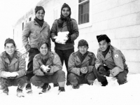 Company B with snow at Camp McCoy, Wisconsin. [Courtesy of Mrs. William Takaezu]